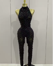 Teyah wearing a sparkly red diamonds mesh see through jumpsuit for a luxury prom look.