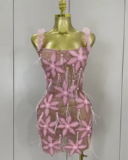 Tati wearing a sparkly diamond flowers feathers short dress for prom night.