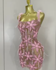 Tati wearing a sparkly diamond flowers feathers short dress for prom night.