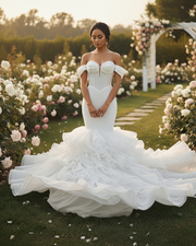 Modern mermaid wedding dress with fitted bodice and flared hem for elegant bridal look.