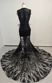 Black beaded sweetheart mermaid prom gown with fitted silhouette and flared hem