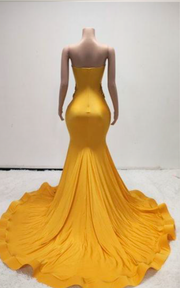 Eden Yellow mermaid evening gown with sheer beaded corset bodice and flowing train for evening events, birthdays, or stage appearances.