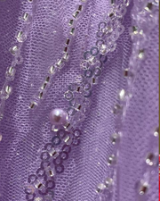 Lilac one shoulder corset ball gown with corset bodice and cloud ruffle hem