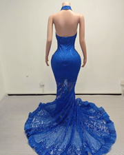 Glitter gold prom dress with blue sequin mesh and rhinestone accents, styled for formal events and glamorous occasions.