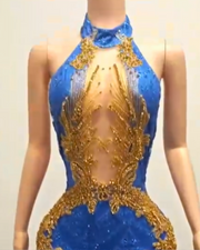 Glitter gold prom dress with blue sequin mesh and rhinestone accents, styled for formal events and glamorous occasions.