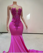 Luxury evening gown with rose rhinestone appliqué and beaded embellishments, styled for formal events and high-glamour occasions.