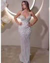 white mesh halter dress with pearl embellishments, styled for elegant evenings and bridal-inspired events.


