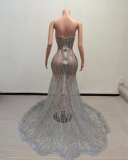 Skylar sparkly silver prom dress with shimmering sequins and elegant fitted design.