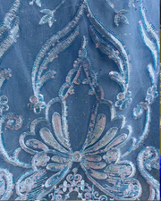 Sky blue quinceañera ball gown with glitter tulle, beaded sleeves, and full princess skirt.