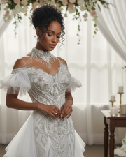 Luxury lace cap sleeve wedding gown with fitted bodice and flowing skirt for elegant bridal wear.