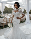 Summer mermaid wedding dress with high neck, fitted silhouette, and elegant detailing for brides.
