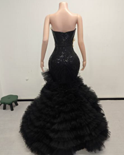 Sweetheart prom dress with floral appliqués and dramatic ruffled tulle skirt