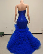 Sweetheart prom dress with floral appliqués and dramatic ruffled tulle skirt