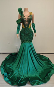 Emerald green velvet and sequin brocade mermaid gown with one shoulder drape