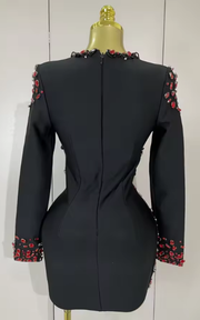 Camille sexy black bandage dress with long sleeves, deep V neckline, and rhinestone detailing for evening and birthday parties