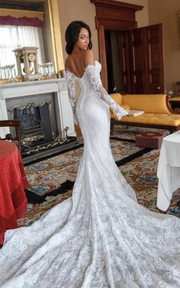 Lace sweetheart mermaid wedding dress with lace appliqués and sweep train for brides.