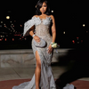 Sequin one-shoulder crystal mermaid prom dress with sparkling detailing and dramatic silhouette.