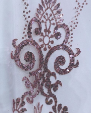 Off shoulder white and rose gold quinceañera ball gown with crystal bodice.