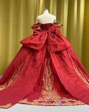 Scarlet red off-shoulder quinceañera dress with sparkling sequins and princess ball gown silhouette.