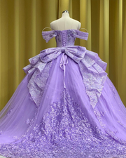 Lilac glitter quinceañera ball gown with layered ruffles and sparkling tulle.