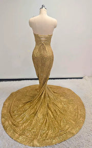 Radiant gold sequin mermaid gown with 3D gilded leaf appliqués, illusion plunging neckline, and circular cathedral train