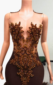 Luxury formal gown featuring bronze embellishments and layered tulle