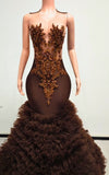 Luxury formal gown featuring bronze embellishments and layered tulle