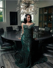 Green glitter beaded rhinestone mermaid prom dress with shimmering details.