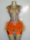 Mannequin Wearing a Fuchsia Orange Feathered Mini Birthday Dress with Vibrant Plumes and Crystal Embellishments, Styled for Luxe Celebrations