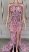 Nylah strapless rhinestone prom dress with high slit and see-through mesh design.