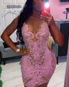 Woman Wearing a Pink Hand Beaded Crystal Mini Cocktail Dress with Intricate Embellishments and a Flattering Silhouette, Styled for Luxe Celebrations