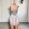 Mannequin Wearing a Sweetheart White Feather Beaded Cocktail Dress with Delicate Embellishments and Feather Accents, Styled for Luxe Celebrations