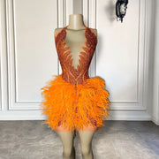 Mannequin Wearing a Sexy See Through Luxury Orange Diamond Birthday Dress with Sparkling Mesh and Crystal Embellishments, Styled for Bold Celebrations