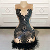 Mannequin Wearing a Black Sheer Cocktail Birthday Dress with Beaded Details and Feather Trim, Styled for Glamorous Celebrations