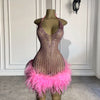 Mannequin Wearing a Pink Feather Handmade Beaded Halter Mini Birthday Dress with Intricate Embellishments and Feather Accents, Styled for Glamorous Celebrations